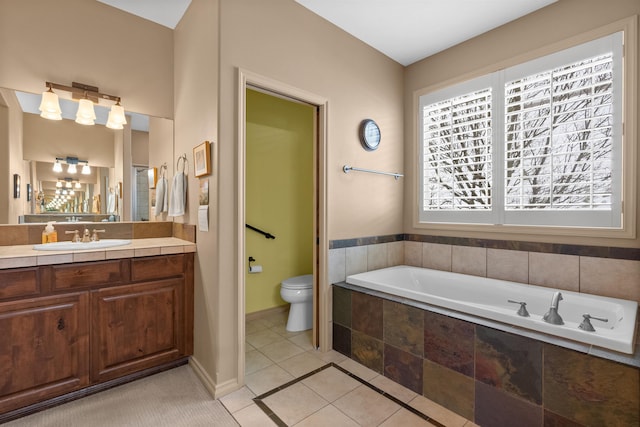 813 E Wandermere Estates Ln, Spokane, WA 99208 - bathroom featuring a garden tub, vanity, and tile patterned floors