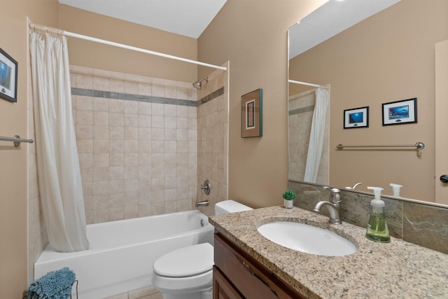 bathroom featuring vanity, shower / bath combo with shower curtain, and toilet