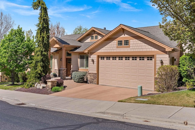 craftsman inspired home with driveway, a shingled roof, stone siding, and a garage