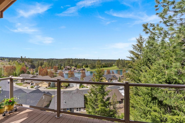 813 E Wandermere Estates Ln, Spokane, WA 99208 - wooden terrace with a water view and a view of trees