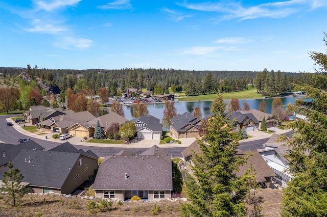 bird's eye view with a residential view, a water view, and a forest view