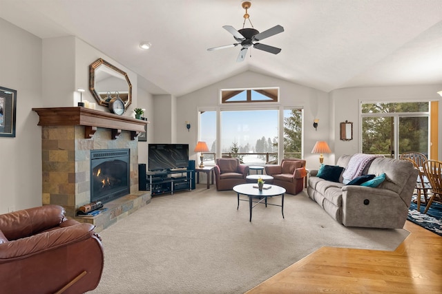 813 E Wandermere Estates Ln, Spokane, WA 99208 - living area with a tiled fireplace, vaulted ceiling, and ceiling fan
