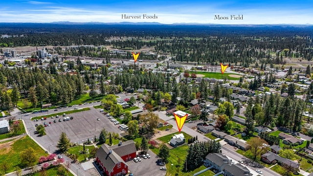 birds eye view of property featuring a view of trees