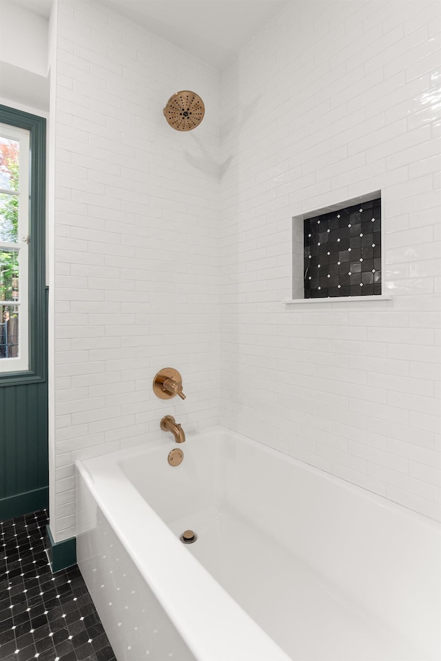 bathroom with tile patterned floors and  shower combination