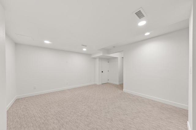 finished basement featuring recessed lighting, baseboards, visible vents, and light colored carpet
