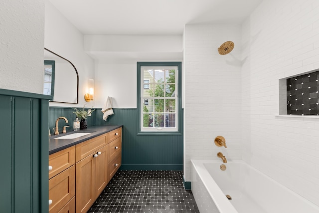 full bathroom featuring wainscoting, bathing tub / shower combination, tile patterned flooring, and vanity