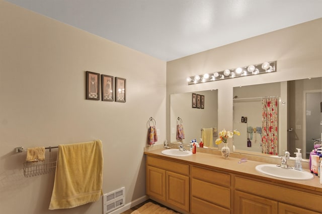 full bath featuring visible vents, a sink, double vanity, and a shower with curtain
