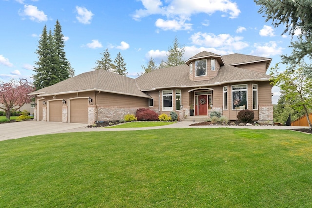 view of front facade with a garage, a shingled roof, concrete driveway, and a front lawn