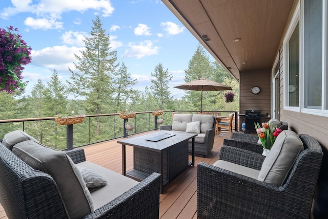 wooden terrace with visible vents, an outdoor hangout area, and area for grilling