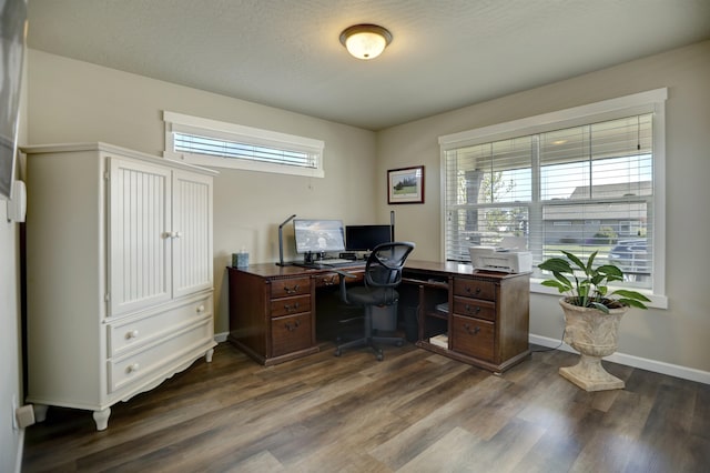 office featuring baseboards and dark wood finished floors