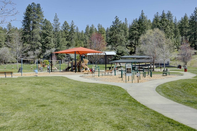 view of property's community with a yard and playground community