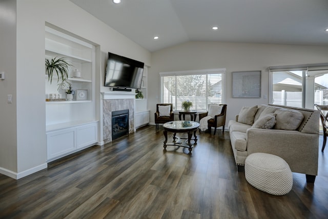 living room featuring built in features, a fireplace, dark wood finished floors, lofted ceiling, and recessed lighting