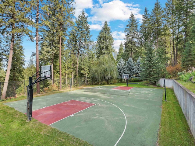 view of sport court featuring fence and community basketball court