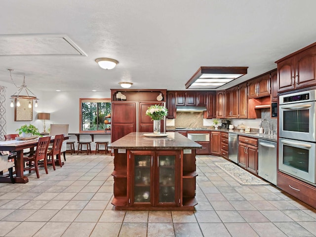 kitchen featuring open shelves, a sink, appliances with stainless steel finishes, and light tile patterned floors