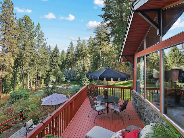 wooden deck with outdoor dining area