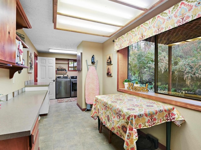 dining space featuring washing machine and clothes dryer