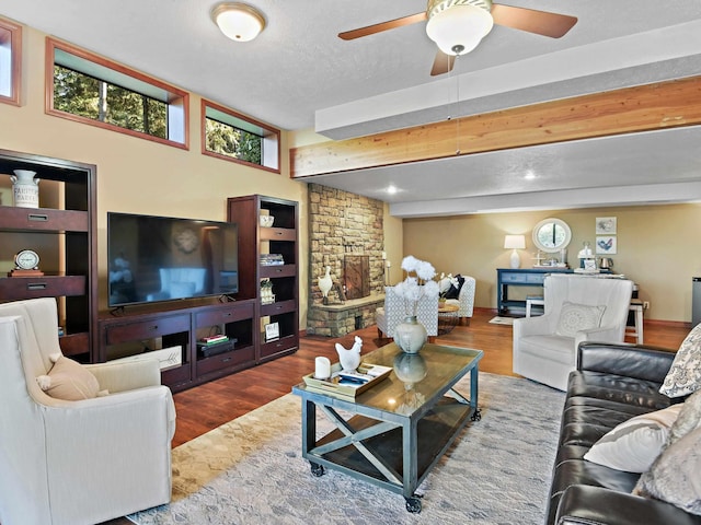 living area with a ceiling fan and wood finished floors