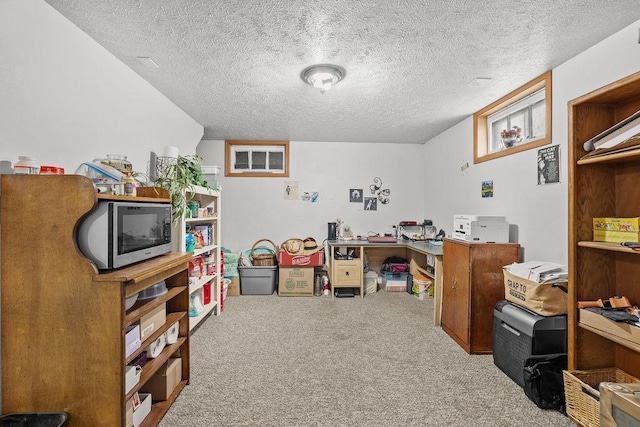office area featuring carpet floors and a textured ceiling