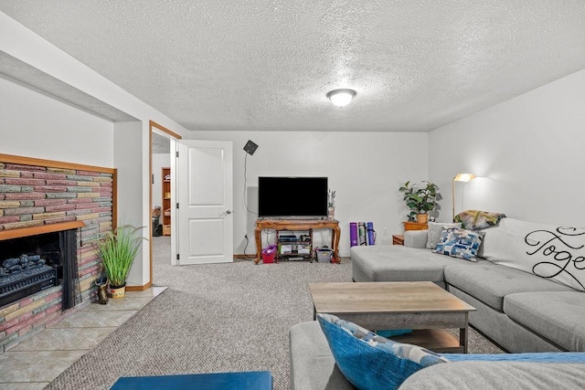carpeted living room featuring a textured ceiling and a fireplace