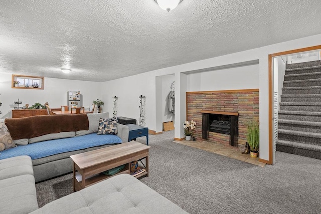 carpeted living area with stairs, a textured ceiling, baseboards, and a fireplace