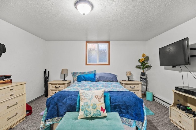 bedroom with a textured ceiling, carpet, and baseboard heating