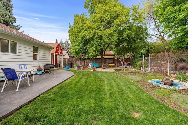 view of yard with a fenced backyard and a patio area