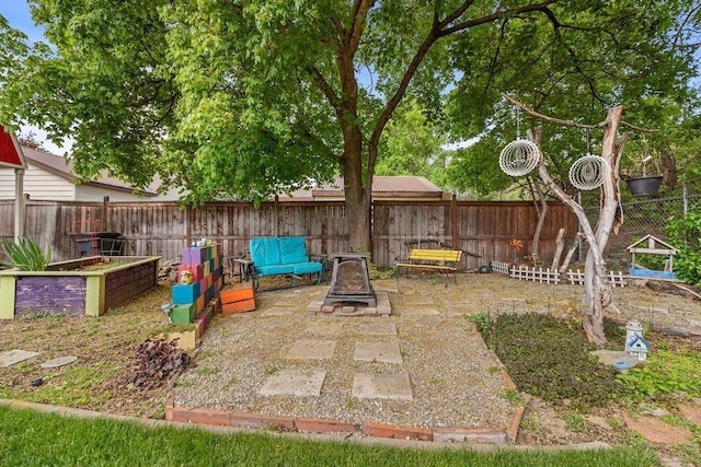 view of yard featuring a patio and a fenced backyard