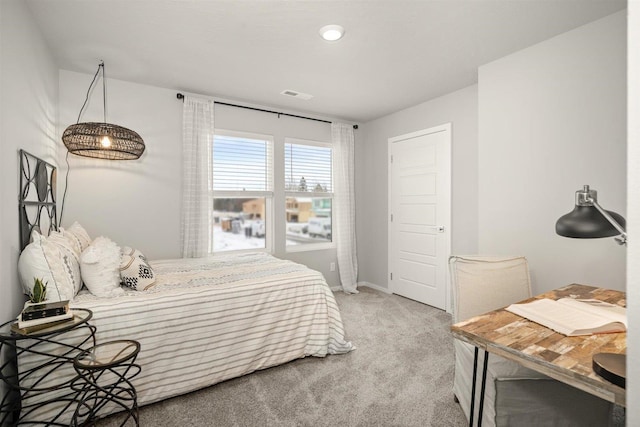 bedroom featuring carpet floors, baseboards, and visible vents