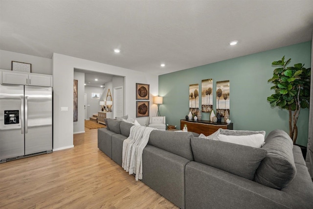living room with recessed lighting and light wood finished floors