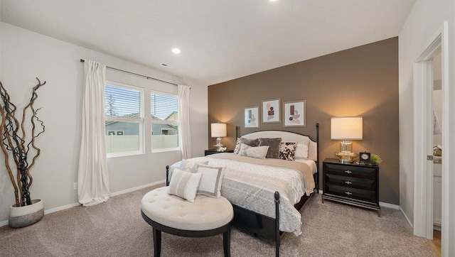 bedroom featuring baseboards, visible vents, recessed lighting, and light colored carpet