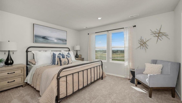 bedroom featuring baseboards, recessed lighting, visible vents, and light carpet