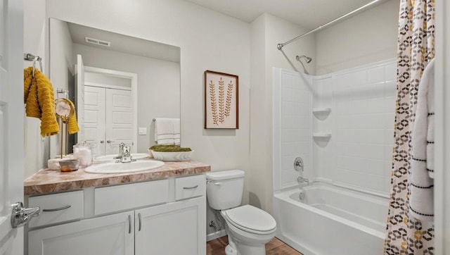 bathroom featuring vanity, toilet, shower / bathtub combination with curtain, wood finished floors, and visible vents