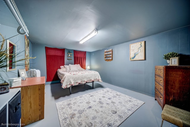 bedroom with finished concrete floors
