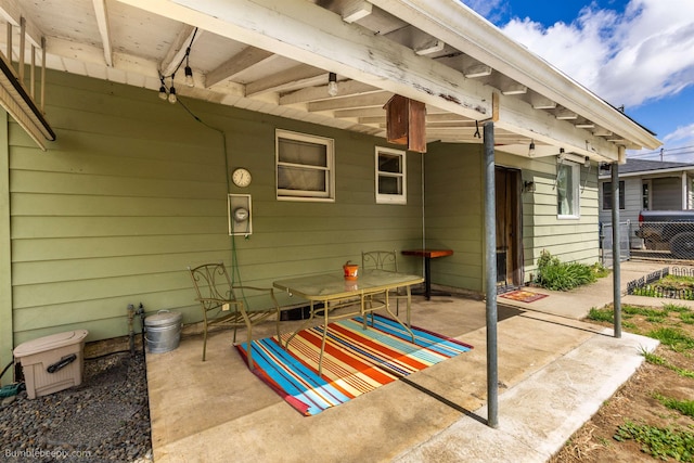 view of patio featuring fence