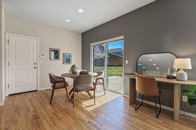 dining room with recessed lighting, baseboards, light wood finished floors, and visible vents