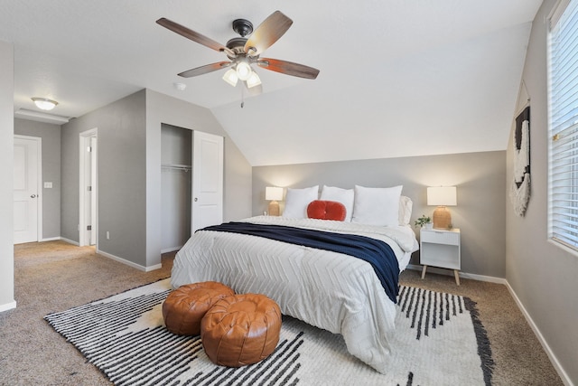 bedroom featuring carpet flooring, ceiling fan, baseboards, lofted ceiling, and a closet