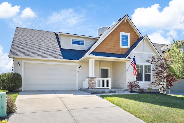 craftsman house featuring an attached garage, a front yard, roof with shingles, concrete driveway, and a porch