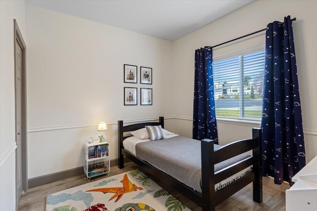 bedroom featuring wood finished floors