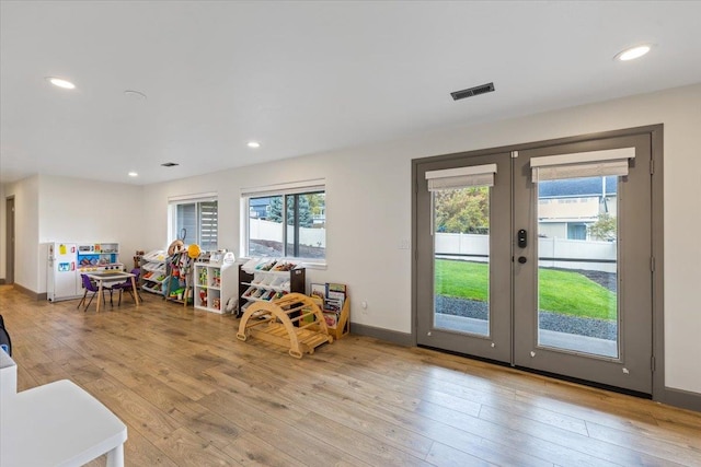 playroom featuring recessed lighting, visible vents, french doors, and hardwood / wood-style floors