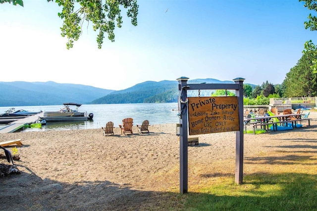 view of community featuring a water and mountain view