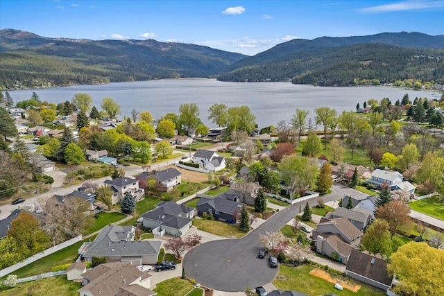 aerial view with a residential view and a water and mountain view