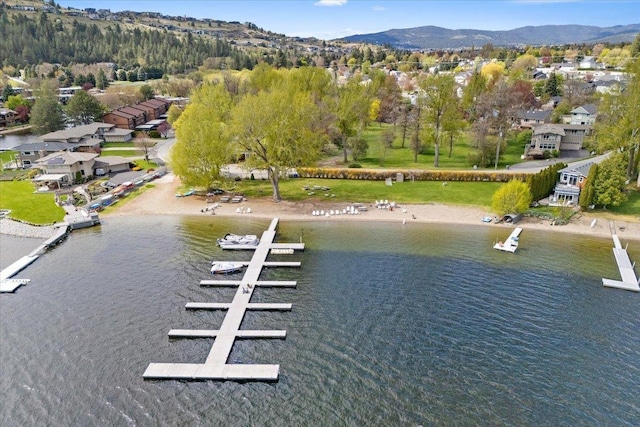 bird's eye view with a residential view and a water and mountain view