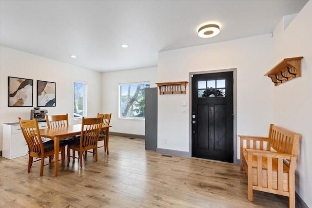 dining room with baseboards, recessed lighting, light wood-style flooring, and visible vents