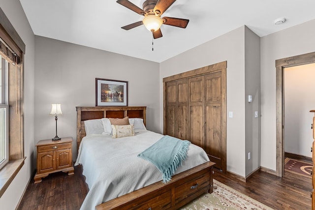 5034 Bittrich Antler Rd, Deer Park, WA 99006 - bedroom featuring baseboards, a ceiling fan, a closet, and hardwood / wood-style flooring