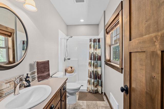 5034 Bittrich Antler Rd, Deer Park, WA 99006 - bathroom with visible vents, a stall shower, toilet, and vanity