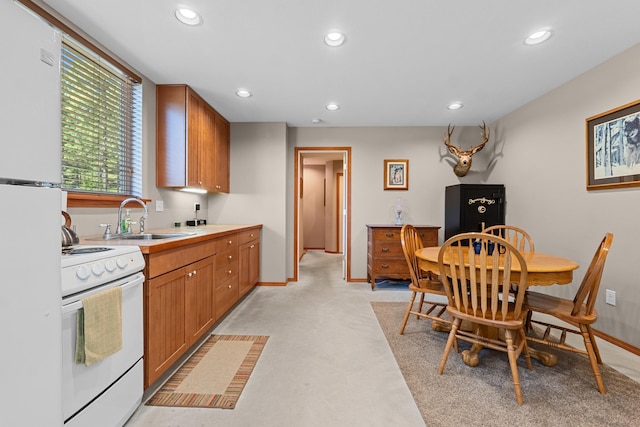 5034 Bittrich Antler Rd, Deer Park, WA 99006 - kitchen with a sink, recessed lighting, baseboards, and white appliances