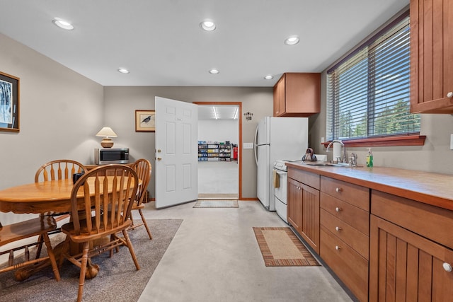 5034 Bittrich Antler Rd, Deer Park, WA 99006 - kitchen with a sink, light countertops, brown cabinetry, and recessed lighting