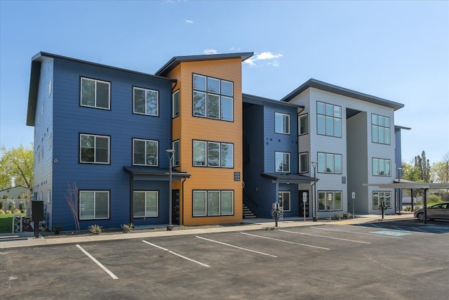 view of property with uncovered parking