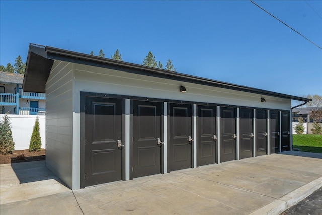 garage with fence
