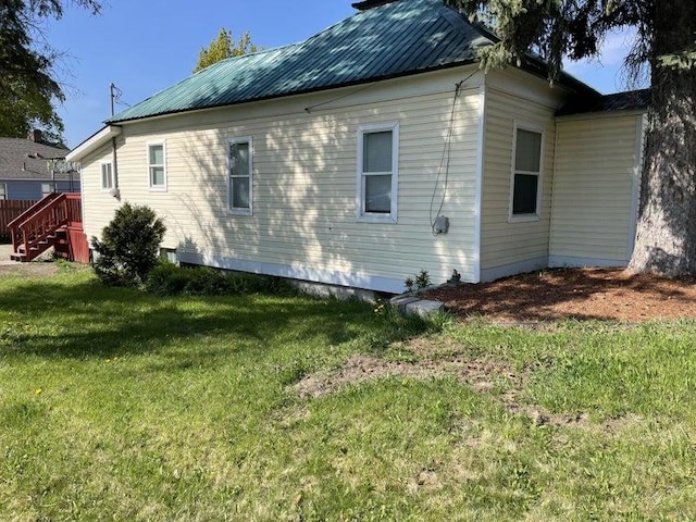 558 E Birch Ave, Colville, WA 99114 - view of side of property featuring a yard and metal roof